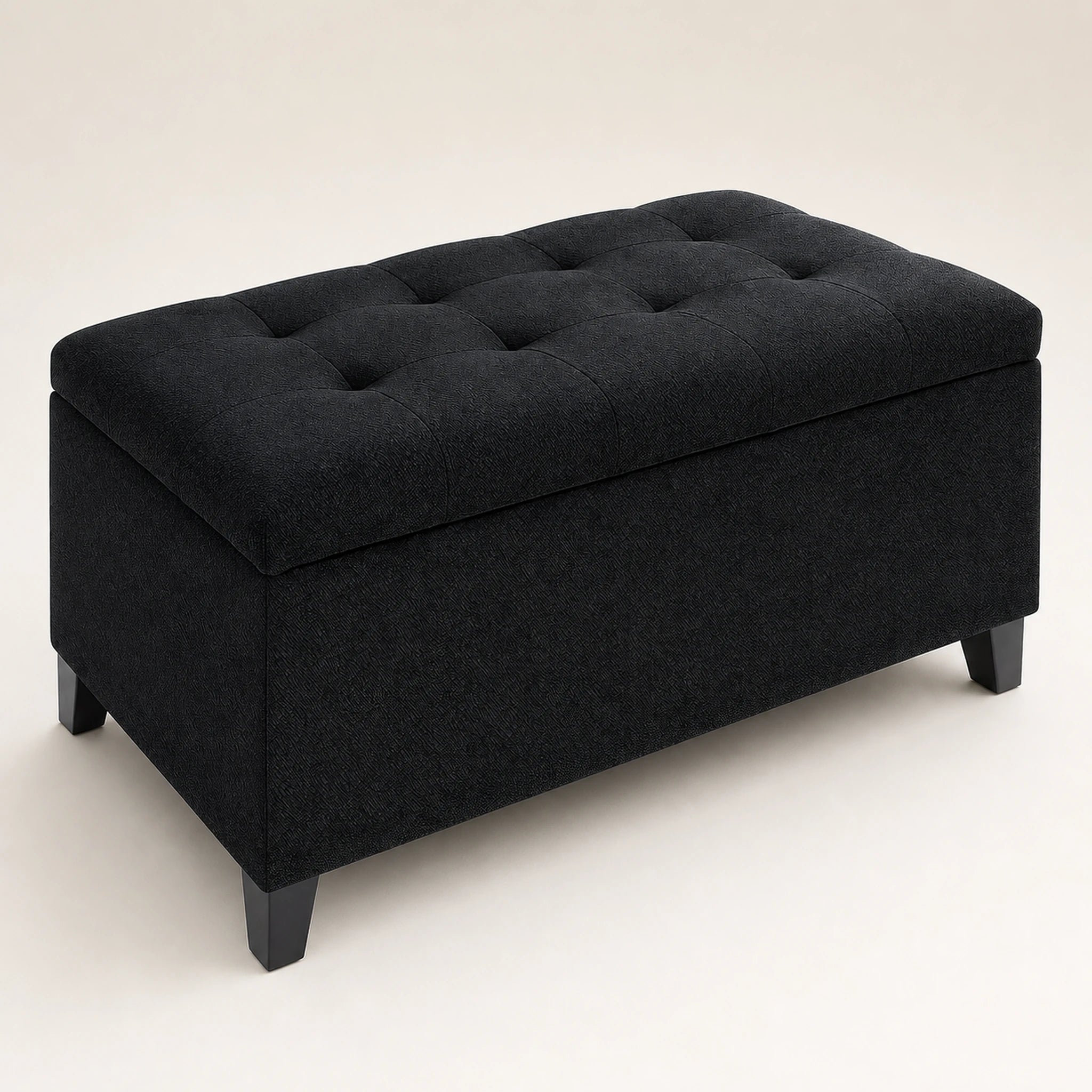 Beringia Black linen 33-inch storage ottoman – warm studio front view
