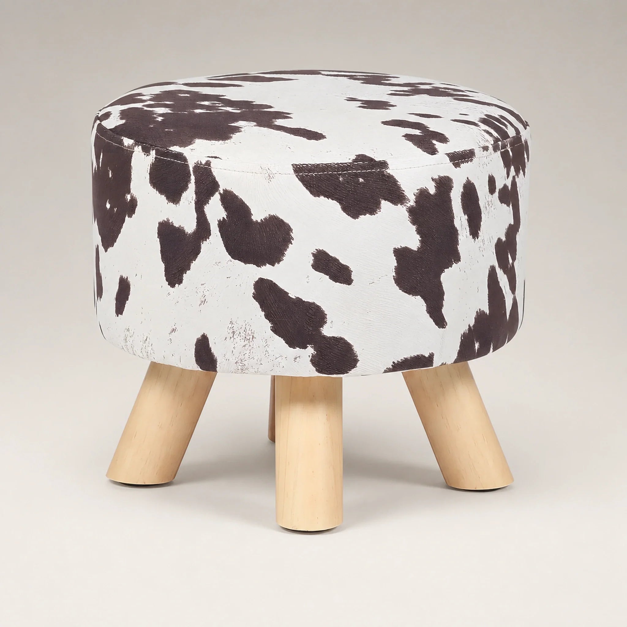 Deco Cow Brown storage ottoman – warm studio front view