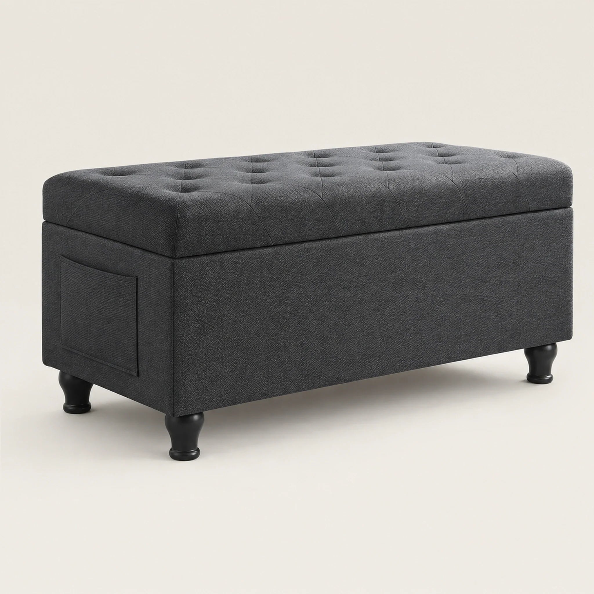 Deco Dark Grey storage ottoman – warm studio front view