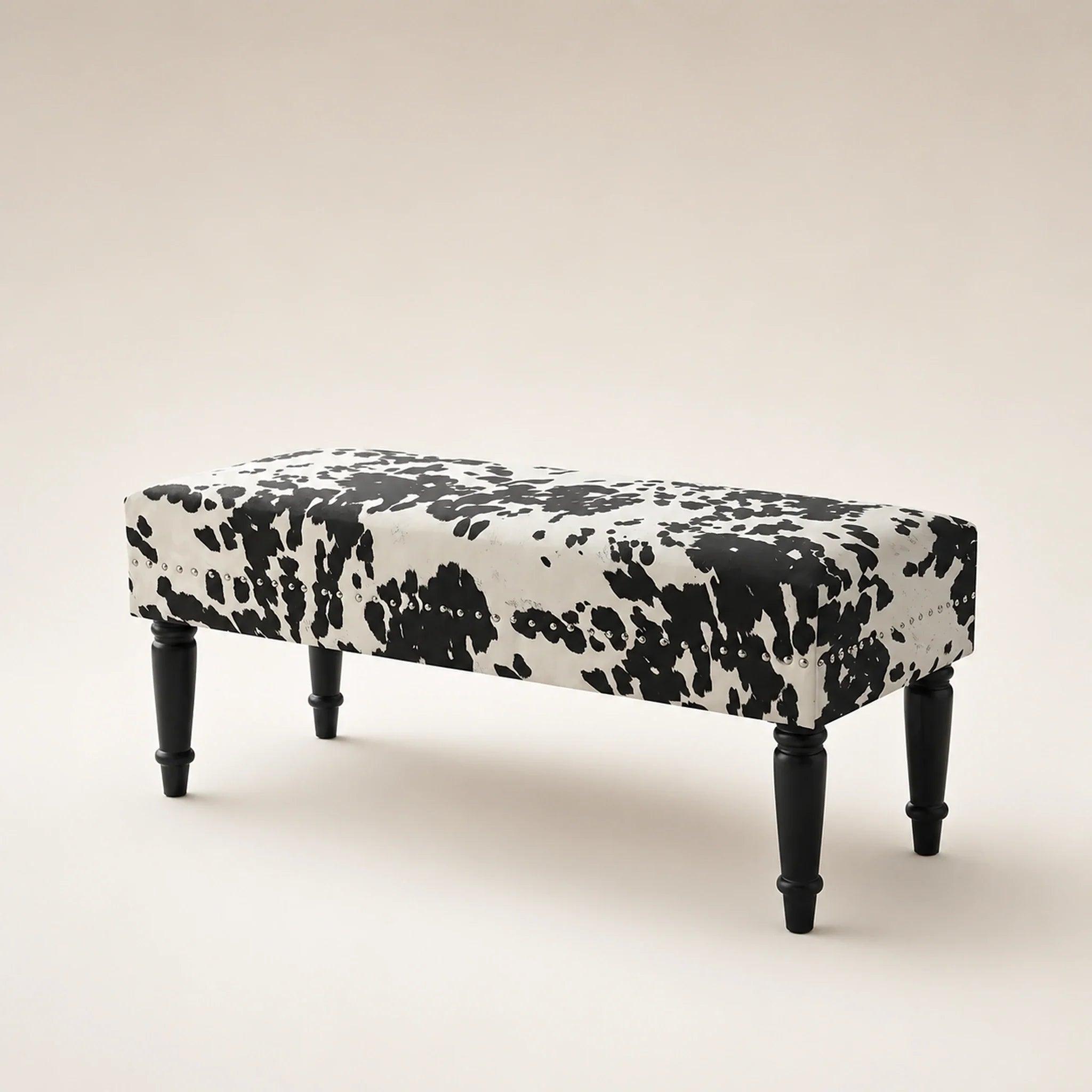 Homebeez Black Cow storage ottoman – warm studio front view#Color_Black Cow